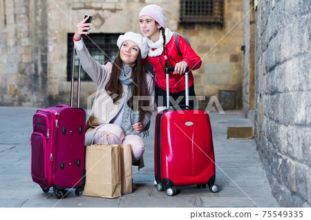 female and child in the center taking selfie 75549335