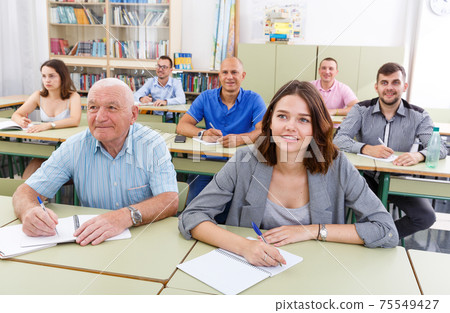 Men and women ready take a written exam 75549427