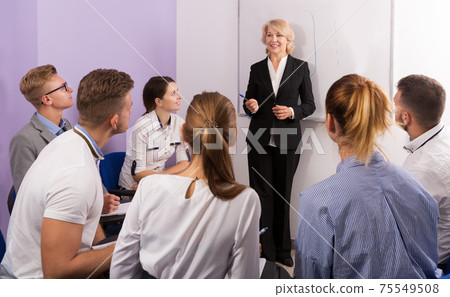 students attentively listening to lecture 75549508