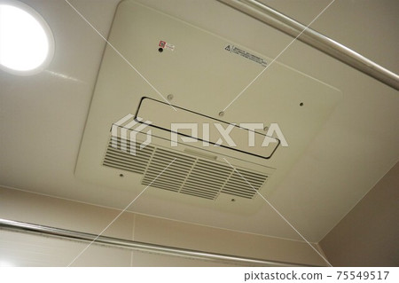 Bathroom dryer installed on the ceiling of the bath 75549517