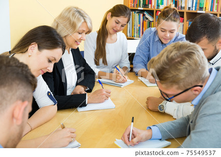 Students with educator doing group study together Students with educator doing group study together 75549537