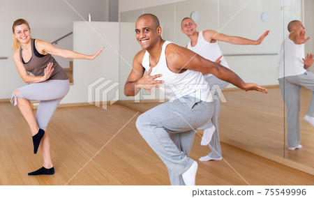 Group of activity people practicing dance techniques Group of activity people practicing dance techniques 75549996