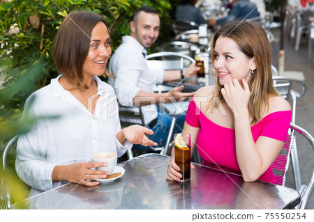 Girlfriends are talking and iteresting by male Girlfriends are talking and iteresting by male 75550254