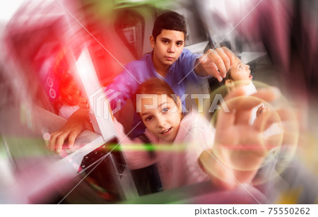 Interested tweens trying to get out of escape room, toned image 75550262