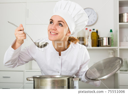 Female cook tasting food 75551006