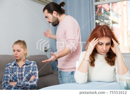 Sad mature woman sitting after conflict with adult children in home 75551012