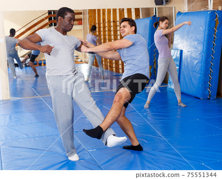 Two men practicing self defense techniques 75551344
