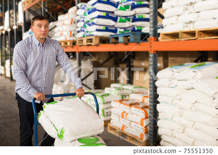 Man choosing materials for home renovation Man choosing materials for home renovation 75551350