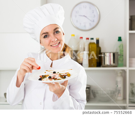 Female cook preparing food 75552668