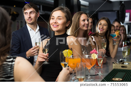 People are talking at the bar counter People are talking at the bar counter 75553065