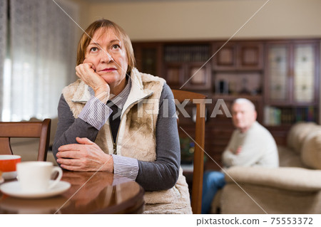 Offended elderly woman during quarrel with husband Offended elderly woman during quarrel with husband 75553372