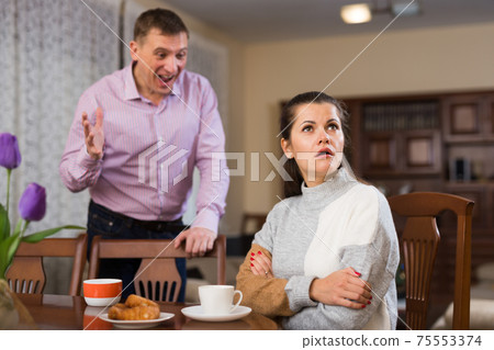 Annoyed husband and wife quarreling Annoyed husband and wife quarreling 75553374
