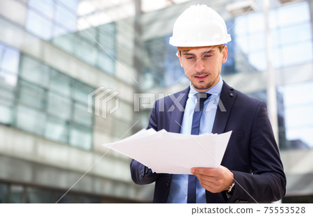 Portrait of cheerful man working outdoors Portrait of cheerful man working outdoors 75553528