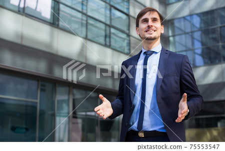 Cheerful man office worker in suit Cheerful man office worker in suit 75553547