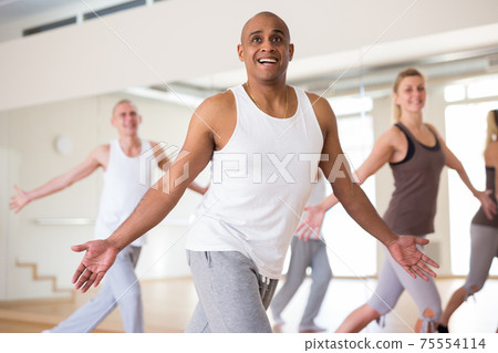 Group of activity people practicing dance techniques Group of activity people practicing dance techniques 75554114