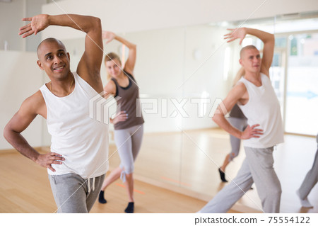Group of activity people practicing dance techniques Group of activity people practicing dance techniques 75554122