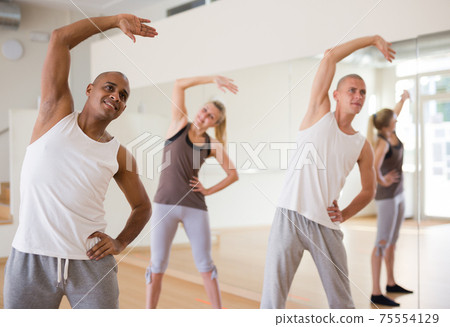 Group of activity people practicing dance techniques Group of activity people practicing dance techniques 75554129
