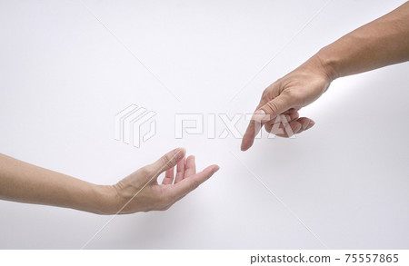 Male and female hands reaching out to each other, creation of adam sign. Isolated. Male and female hands reaching out to each other, creation of adam sign. Isolated. 75557865