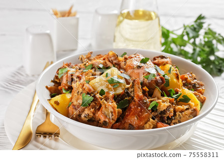 braised Rabbit with potatoes in a white bowl braised Rabbit with potatoes in a white bowl 75558311