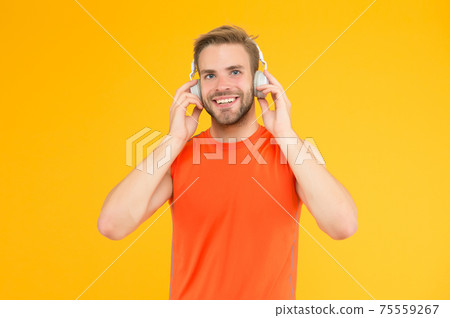 carefree student. male fitness fashion. man in headset 75559267