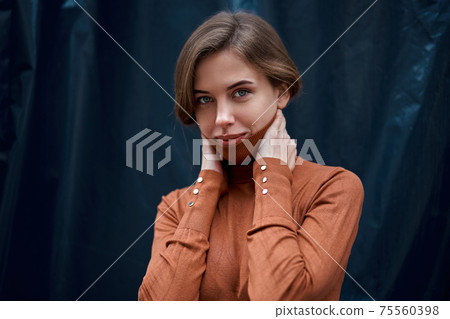 Woman portrait dark background Caucasian female headshoot Woman portrait dark background Caucasian female headshoot 75560398