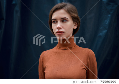 Woman portrait dark background Caucasian female headshoot 75560399
