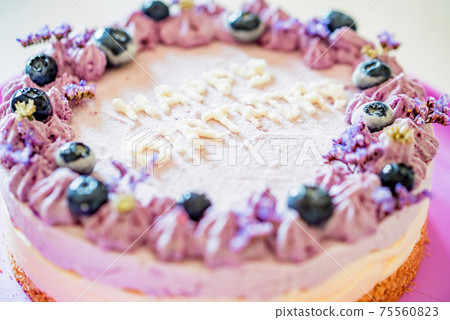 Close up birthday cake with cream and blueberries Close up birthday cake with cream and blueberries 75560823