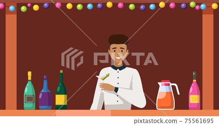 Guy stands with martini in glass and olive. Bartender working in bar is holding alcohol drink 75561695
