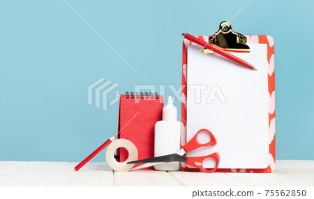 Group of office and school red stationery on desk 75562850