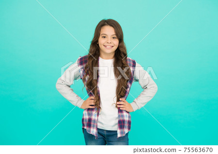Confident in her style. happy small girl turquoise background. Confident in her style. happy small girl turquoise background. 75563670