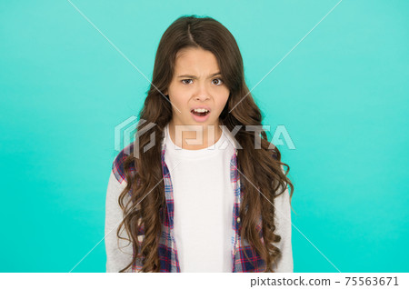 feeling surprised. amazed small girl turquoise background 75563671