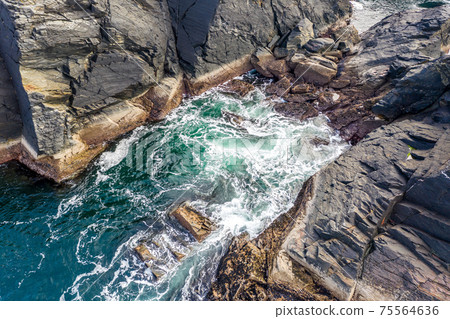 Aerial view of a gully at the coastline at Dawros in County Donegal - Ireland 75564636