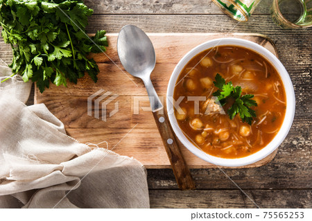 Harira soup in bowl on wooden table. Typical Moroccan food. Ramadan concept. 75565253