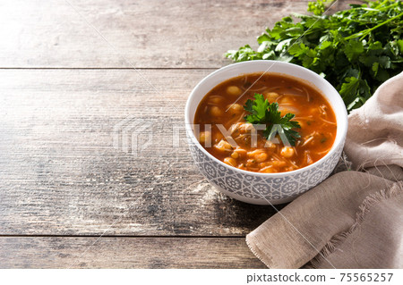 Harira soup in bowl on wooden table. Typical Moroccan food. Ramadan concept. 75565257