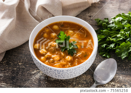 Harira soup in bowl on wooden table. Typical Moroccan food. Ramadan concept. Harira soup in bowl on wooden table. Typical Moroccan food. Ramadan concept. 75565258
