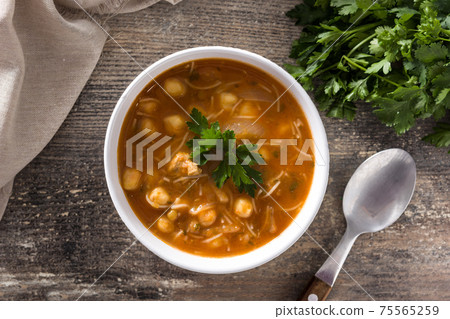 Harira soup in bowl on wooden table. Typical Moroccan food. Ramadan concept. 75565259