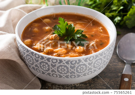 Harira soup in bowl on wooden table. Typical Moroccan food. Ramadan concept. 75565261