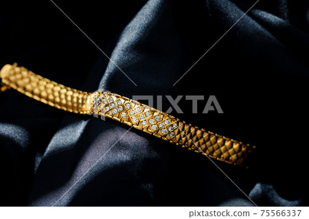 gold with diamond bracelet isolated on black background gold with diamond bracelet isolated on black background 75566337