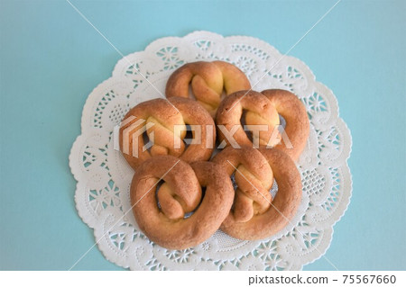 Pretzel cookies on a light blue background 75567660