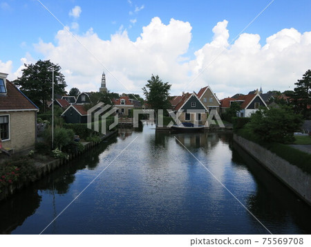Beautiful European village, canals and houses in Hindeloopen, northern Netherlands Beautiful European village, canals and houses in Hindeloopen, northern Netherlands 75569708