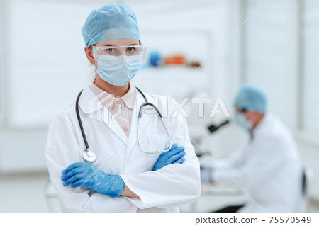 close up. serious woman doctor standing in a medical laboratory. 75570549