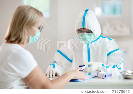 Coronavirus outbreak. Doctor and covid-19 patient. 75570645