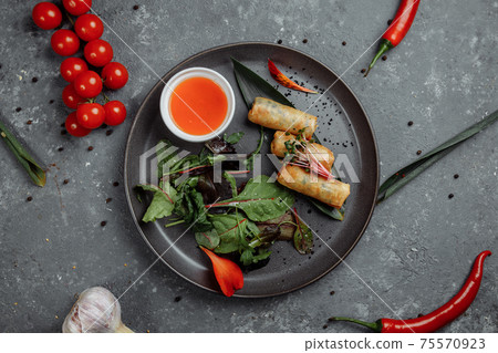 Spring rolls with shrimp with sweet chili sauce. Asian cuisine Spring rolls with shrimp with sweet chili sauce. Asian cuisine 75570923