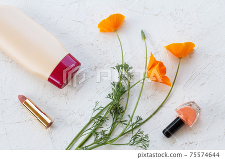 Woman cosmetics with flowers on a white background 75574644