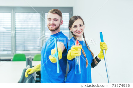 Woman and man in commercial cleaner team 75574956