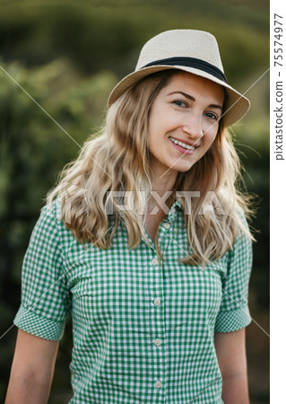 Blonde woman in a hat in Provence France Blonde woman in a hat in Provence France 75574977