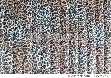 Fashionable leopard-print quilted fabric. Abstract background with leopard pattern .Horizontal orientation 75575247