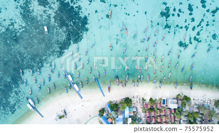 Aerial view of long tail boats in Andaman sea at Lipe Island 75575952