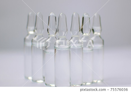 Medical ampoules for injection isolated on white background. Medicines and disease treatment, pharmacology and science concepts Medical ampoules for injection isolated on white background. Medicines and disease treatment, pharmacology and science concepts 75576036