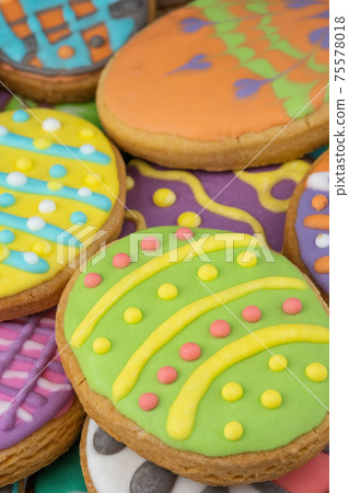 Easter decorated baked eggs, cookies as background Easter decorated baked eggs, cookies as background 75578018